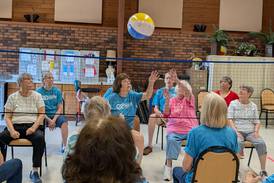 Serving up a good time – Seniors enjoy chair volleyball games at Yorkville’s Beecher Center