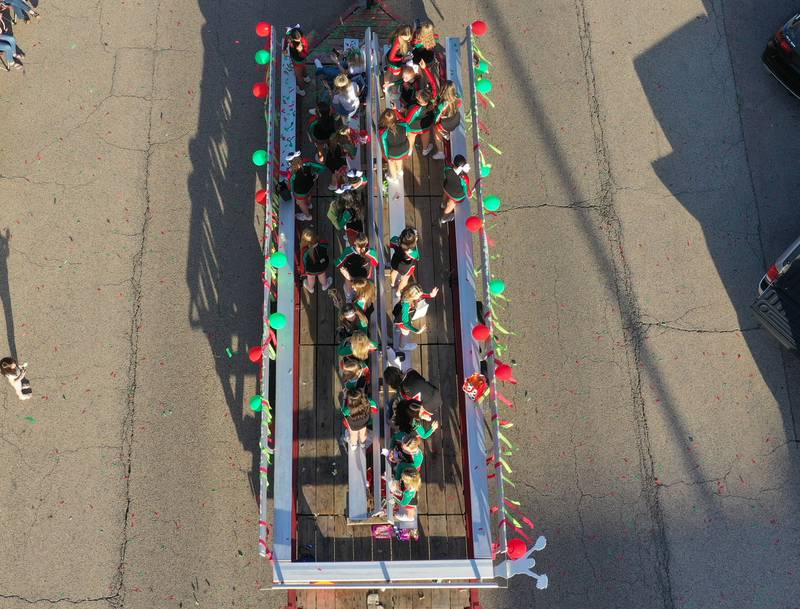 L-P cheerleaders ride in the Homecoming parade on Thursday, Oct. 5, 2023 downtown Peru.