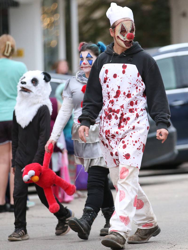Characters from the Nightmare on Fairgrounds Road Haunted Attraction walk during the 5th annual Halloween Parade on Saturday, Oct. 28, 2023 downtown Princeton.