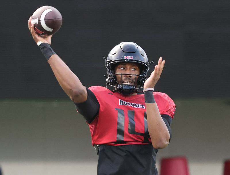 Northern Illinois University quarterback Malik Armstrong delivers a pass Tuesday, April 14, 2026, during a drill at practice in Huskie Stadium at NIU in DeKalb.