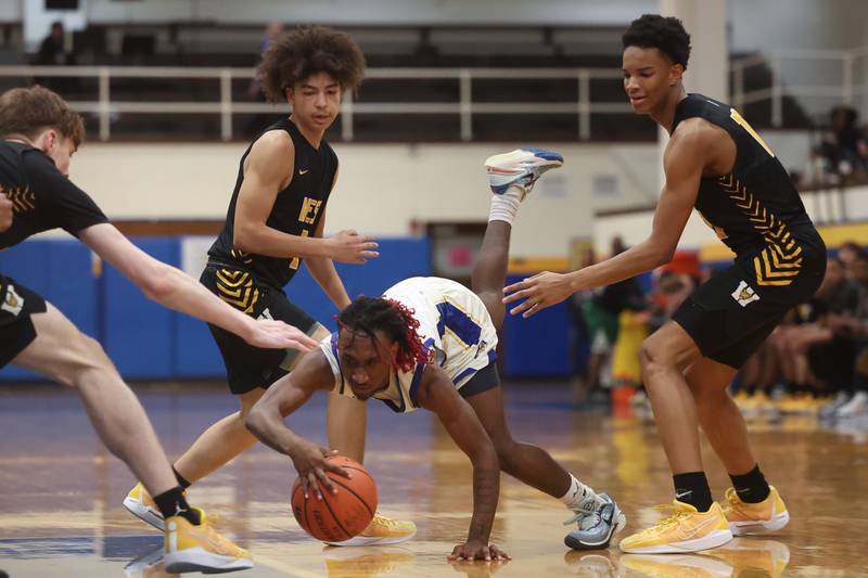 Joliet Central’s Jamarcho Holman dives for the lose ball against Joliet West on Saturday, Jan. 27th, 2024 in Joliet.