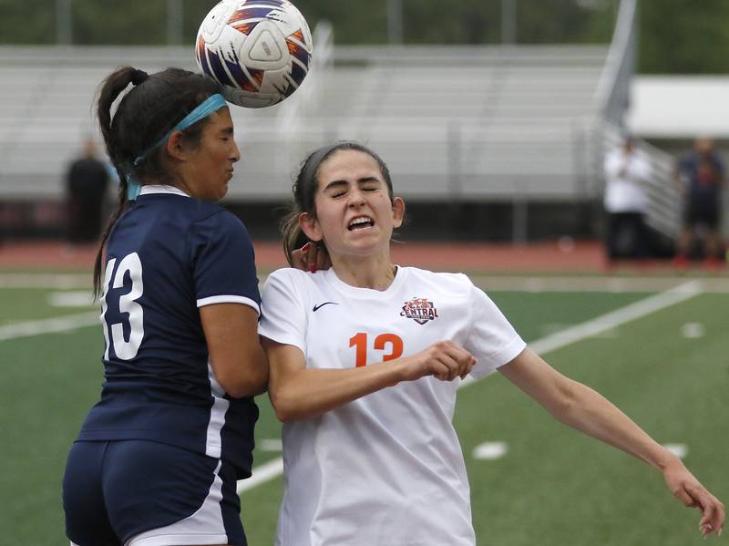 St. Viator's Ava Sclafini heads the ball away from Crystal Lake Central's Jordin Gaunaurd during the IHSA Class 2A Deerfield Sectional championship girls soccer match on Friday, May 30, 2025, at Deerfield High School.