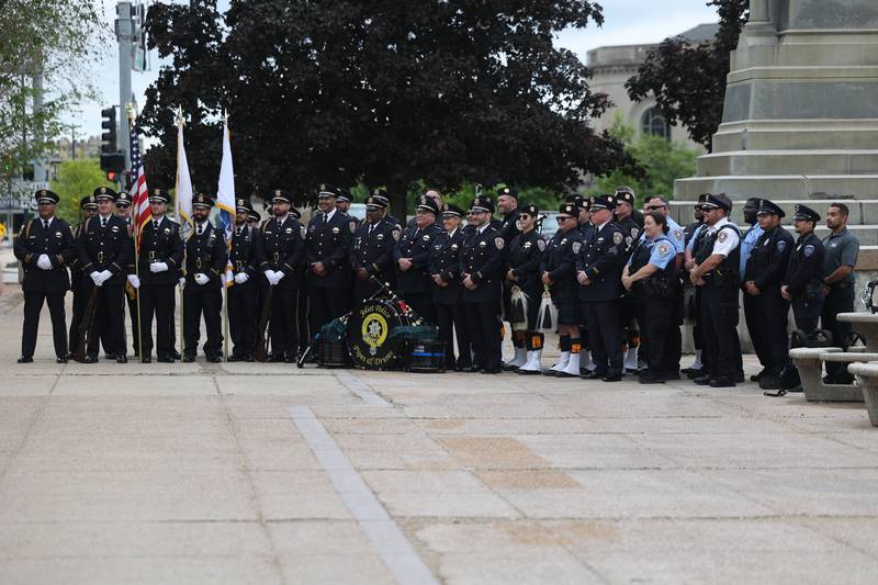 Members of the Joliet Police Department take a group photo after the Will County Law Enforcement Memorial ceremony on Thursday, May 9, 2024 in downtown Joliet.