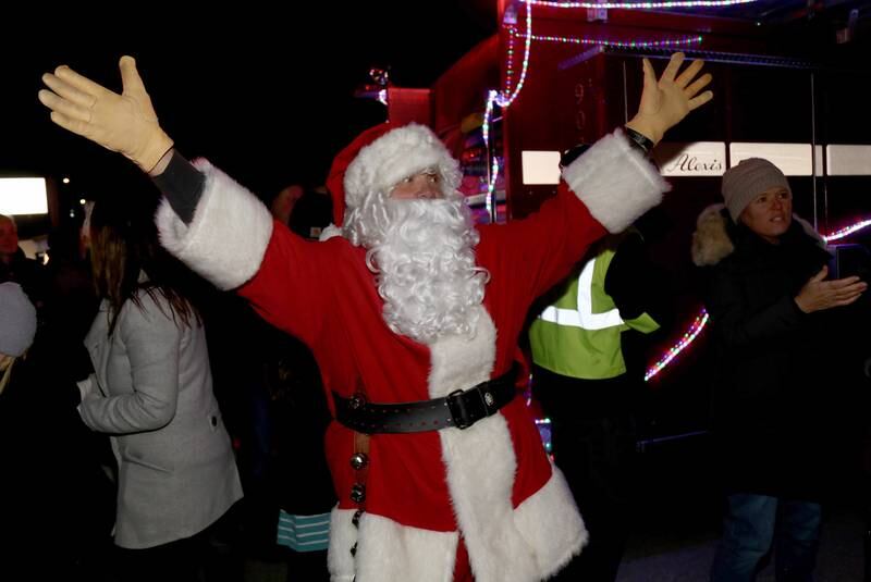 Santa reacts to seeing the tree lit up at the Sugar Grove Holiday Tree Lighting Ceremony on Friday, Dec. 6, 2024.