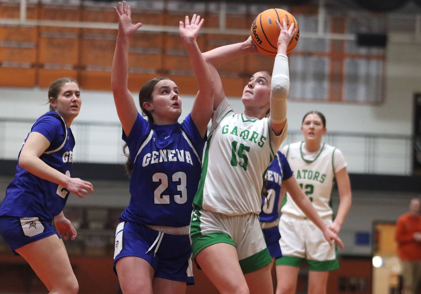 Crystal Lake South’s Tessa Melhuish, right, works under the net as Geneva’s Nora Hatton defends in girls IHSA Class 3A Sectional Championship basketball on Thursday, Feb. 26, 2026, at Crystal Lake Central High School in Crystal Lake.