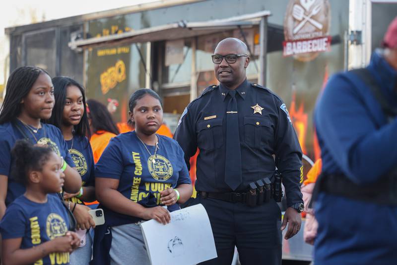Kankakee Police Deputy Chief Donell Austin gathers with a crowd of about 100 people at the conclusion of the 2nd Walk Against Gun Violence in Kankakee on Tuesday, April 29, 2025.