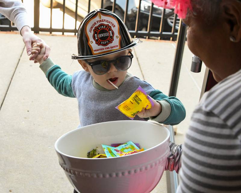 Bennett Tolomei, 2, of Montgomery picks out some candy on Saturday April 12, 2005, during the annual Bunny Hop event held in downtown Oswego.