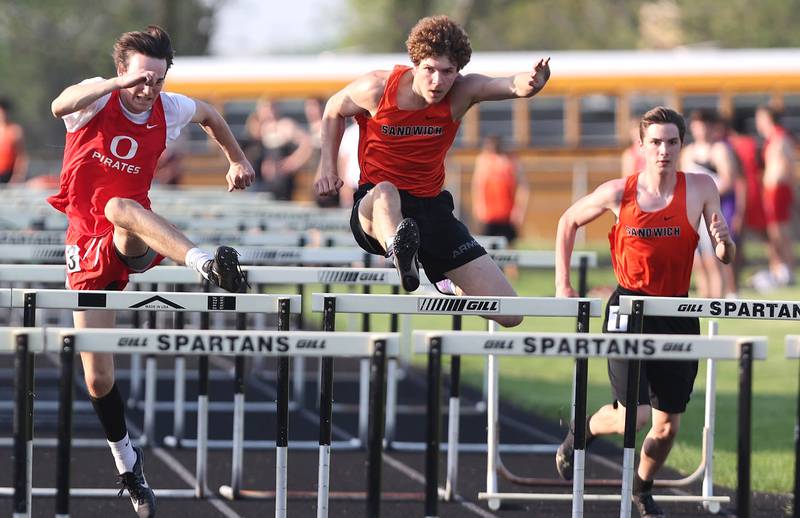 Sandwich's Dylan Young (middle) is just ahead of teammate Brodie Case and Ottawa's Blake Watland in the 110 meter hurdles Friday, May 13, 2022, during the Interstate 8 Conference Championship meet at Sycamore High School. Young would go on to win the race.