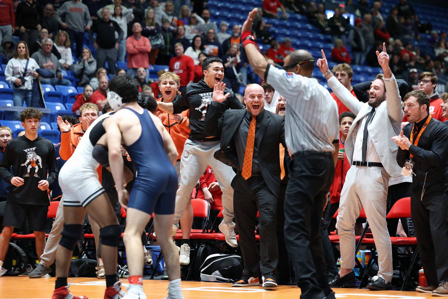 The St. Charles East bench erupts as Isaac Lenard won his 157-pound match to secure the IHSA Class 3A Dual Team State third place victory over Oak Park-River Forest on Saturday, Feb. 28, 2026.