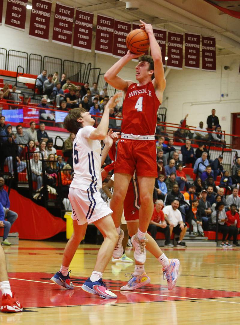 Hinsdale Central's Chase Collignon (4) takes a jump shot during the Hinsdale Central Holiday Classic championship game between Oswego East and Hinsdale Central high schools on Thursday, Dec. 29, 2022 in Hinsdale, IL.
