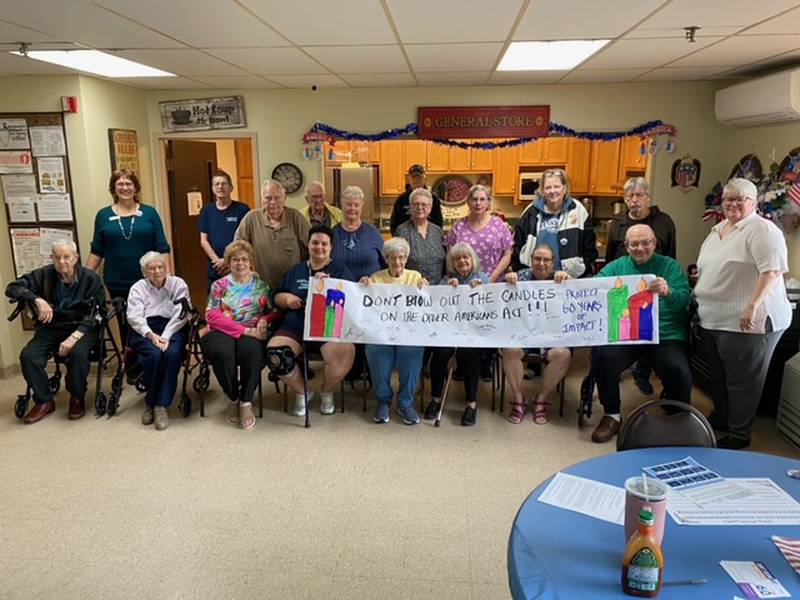 Meals on Wheels participants and volunteers created a community banner advocating support for the Older Americans Act on Wednesday, May 28, 2025.