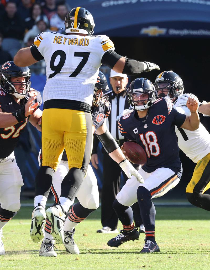 Chicago Bears quarterback Caleb Williams tries to avoid the Pittsburgh Steelers pass rush Sunday, Nov. 23, 2025, during their game at Soldier Field in Chicago.