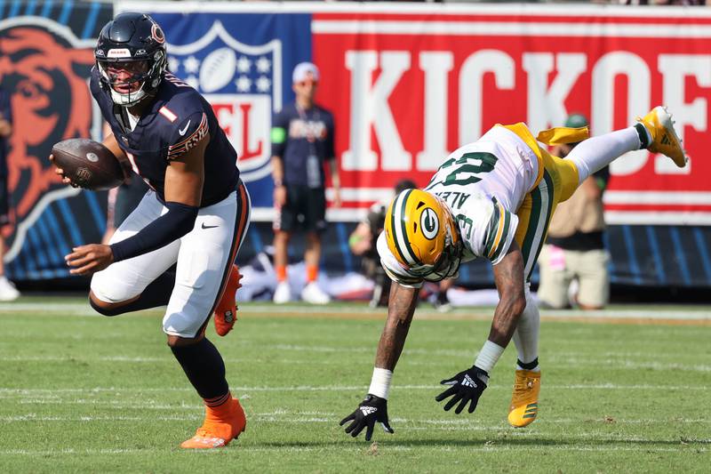 Chicago Bears quarterback Justin Fields escapes the pressure of Green Bay Packers cornerback Jaire Alexander during their game Sunday, Sept. 10, 2023, at Soldier Field in Chicago.