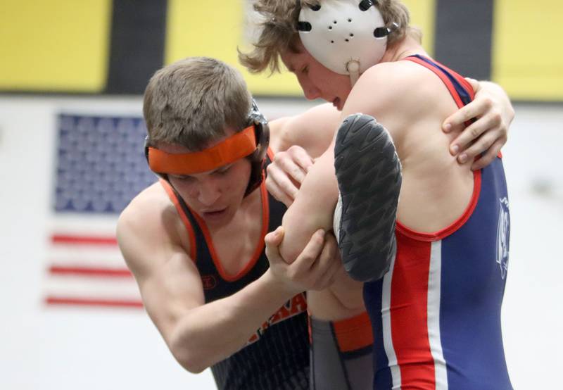 Crystal Lake Central’s Brandon Carbone, left, battles Belvidere North’s Bryson Teunissen at 132 pounds in boys wrestling IHSA Class 2A Regional championship bout action on Saturday, Jan. 31, 2026, at Harvard High School in Harvard.