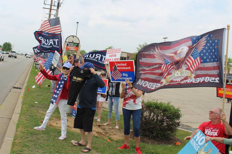 Attendees of the "Silent Majority" rally show support for President Donald Trump on May 17, 2026.