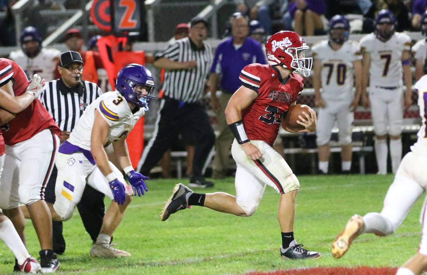 Hall's Aiden Redcliff breaks free of Sherrard's Harison Curry to score a touchdown to put the Red Devils ahead of the Tigers on Friday, Sept. 19, 2025 at Richard Nesti Stadium.