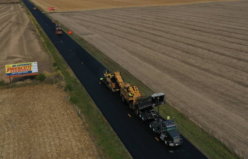 Crews resurface Illinois Route 251 on Friday, Oct. 17, 2025 near the intersection of North 39th Road just south of Mendota. Resurfacing work consists of patching and resurfacing, which is expected to be completed in mid-November. The work zone stretches from the BNSF railroad bridge south of Mendota to just north of Interstate 80 in Peru. The construction will continue into the spring with earth work. Motorists are asked to drive with caution through the construction zone. The Route 251 work between Mendota and Peru will lead to daily lane closures controlled by flaggers.