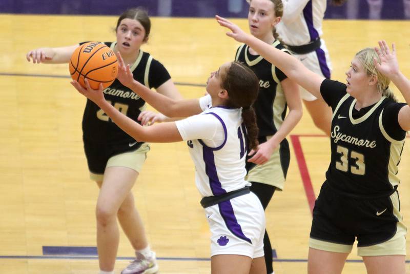 Hampshire’s Mikala Amegasse soars under the hoop against Sycamore in varsity girls basketball on Friday, Jan. 3, 2025, at Hampshire High School in Hampshire.