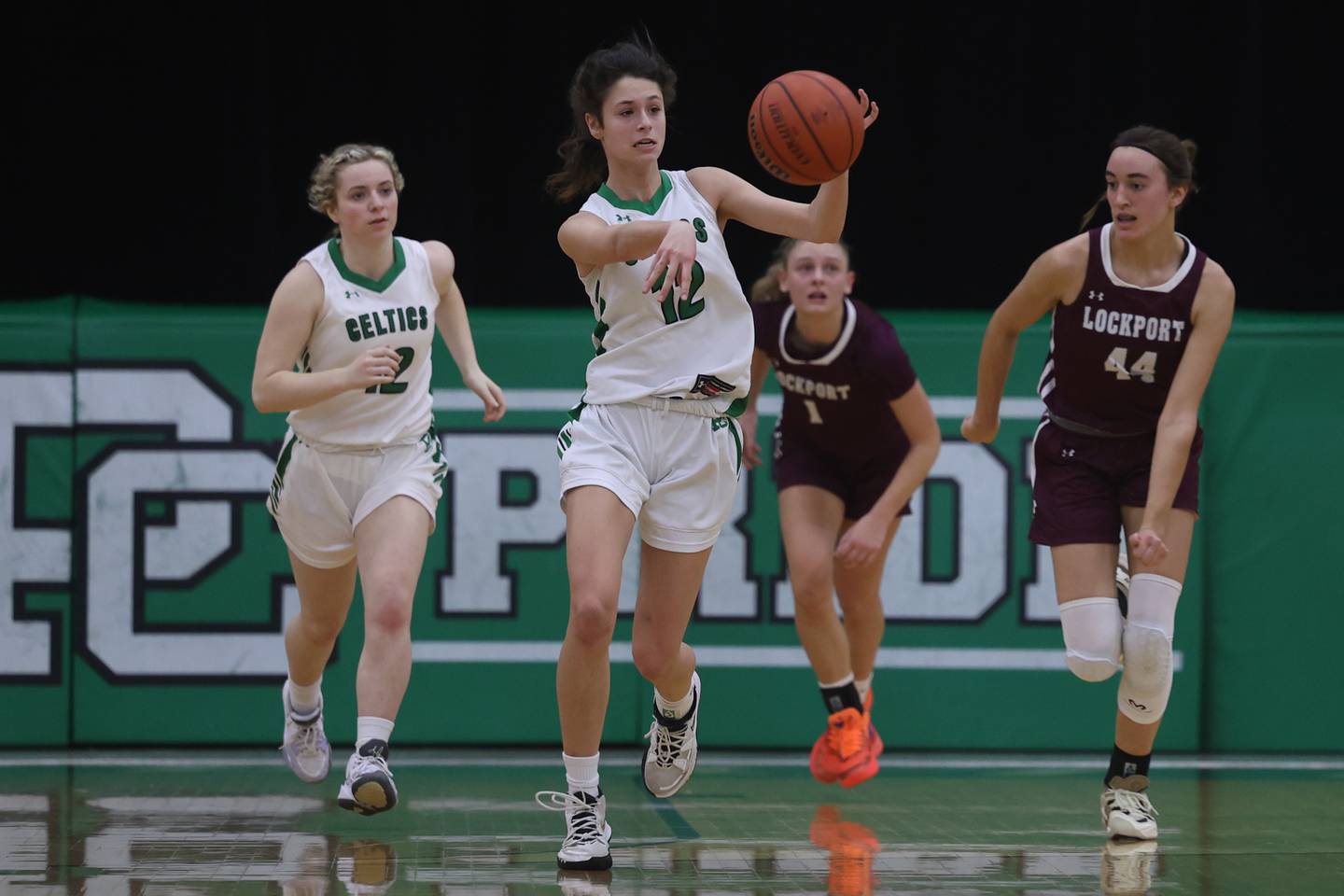 Providence’s Bella Morey makes the long pass against Lockport.