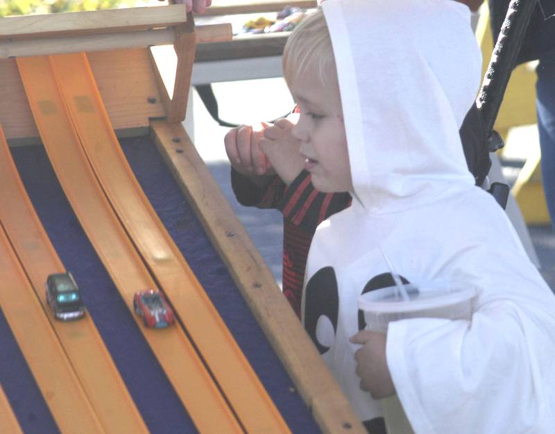 Ollie Ptasnik of Polo watches his  Hot Wheels car at the start. The Craft Beer Festival and Halloween Town offered fun for all in downtown Sterling The events took place on Saturday, October 11th, 2025.