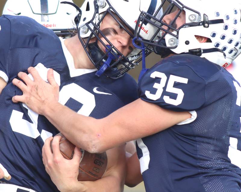 Cary-Grove’s Holden Boone, left, is greeted by Michael Massat after a touchdown against Belvidere North in IHSA Class 6A quarterfinal playoff football action on Saturday, Nov. 16, 2024, at Al Bohrer Field on the campus of Cary-Grove High School in Cary.