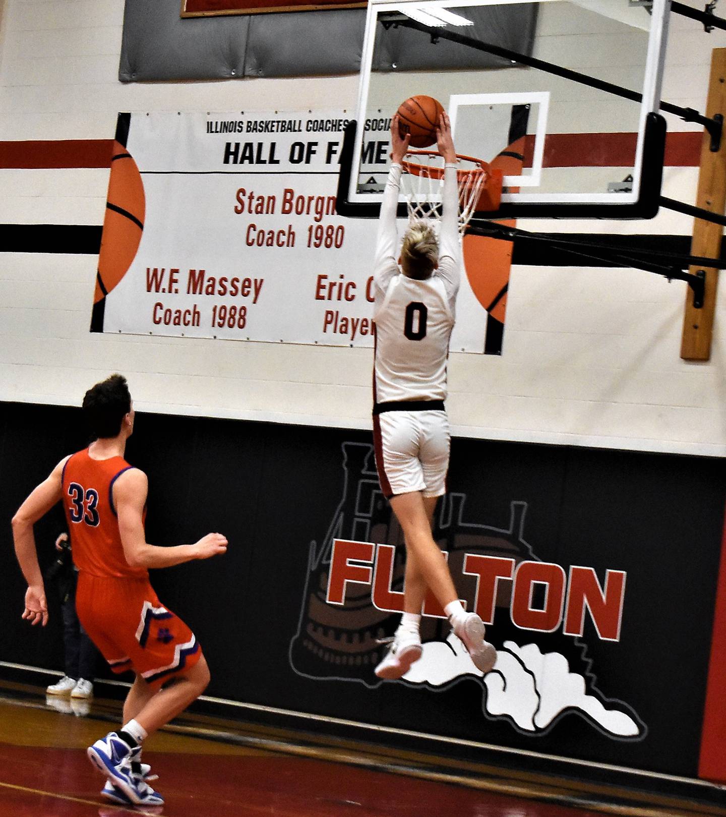 Fulton's Baylen Damhoff (0) drops in two points as he goes above the rim during action against Eastland on Thursday, Feb. 23 at the 1A Fulton Regional.