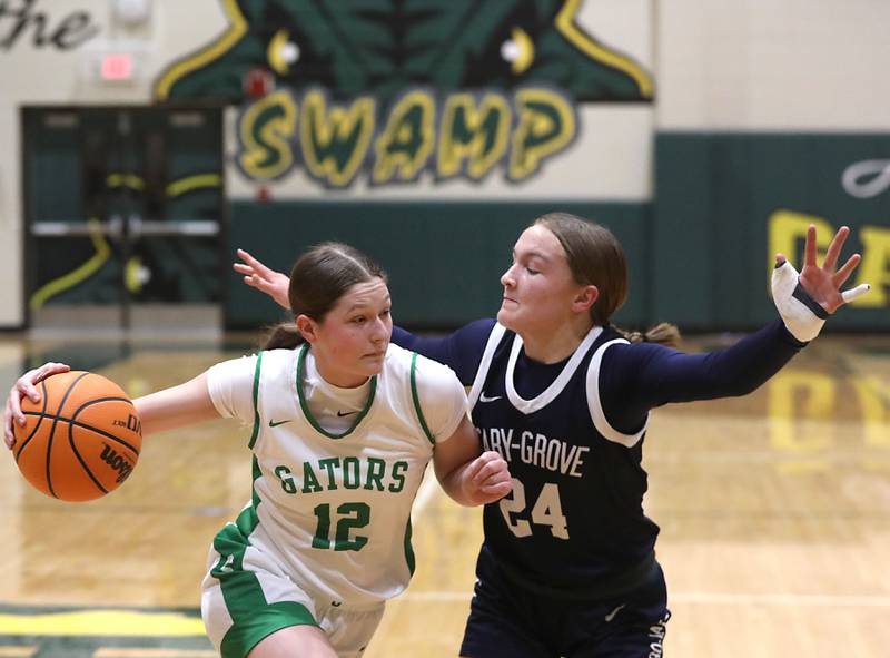 Crystal Lake South's Gaby Dzik drives the baseline against Cary-Grove's Aria Stanton during a Fox Valley Conference girls basketball game on Friday, Jan. 23, 2026, at Crystal Lake South High School.