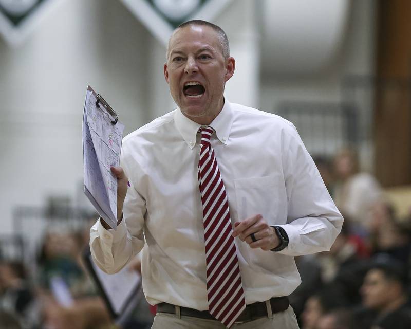 Benet's head coach Brad Baker yells out instructions during Class 4A Glenbard West Sectional final volleyball match between St Charles North at Benet. Nov 6, 2025 in Glen Ellyn.