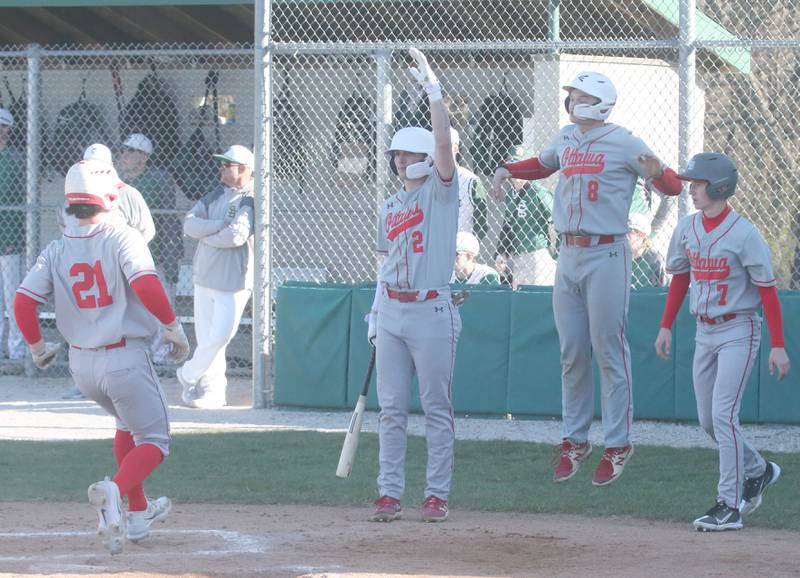 Ottawa's Jace Veith scores the teams fourth run as teammates Packston Miller, Garrett Shymanski and Lucas Farabaugh react while playing St. Bede on Wednesday, March 20, 2024 at St. Bede Academy.