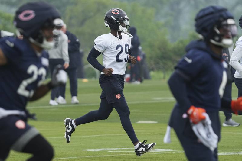 Chicago Bears defensive back Tyrique Stevenson (29) warms up with teammates during NFL football practice at Halas Hall in Lake Forest, Ill., Wednesday, June 4, 2025. (AP Photo/Nam Y. Huh)
