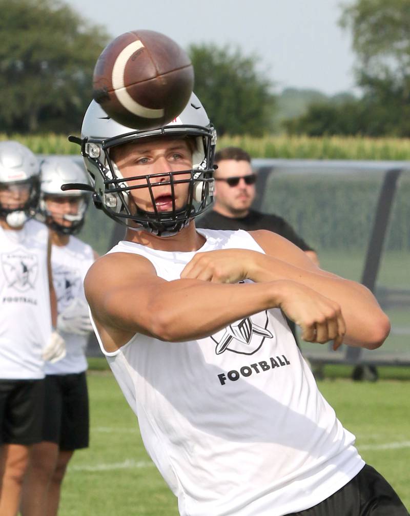 Kaneland quarterback Troyer Carlson fires a pass during 7-on-7 drills against DeKalb Tuesday, July 26, 2022, at Kaneland High School in Maple Park.