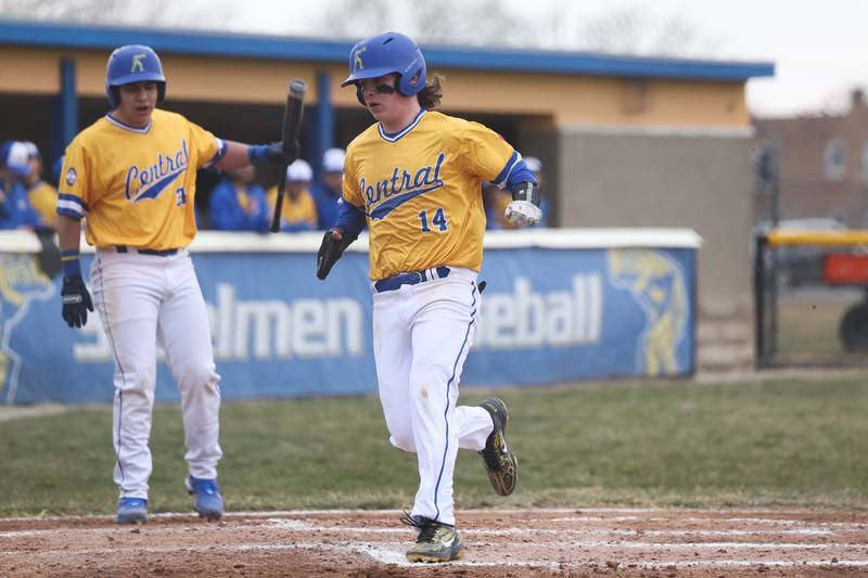 Joliet Central’s John Stasiak scores on a wild pitch against Bolingbrook on Tuesday, March 21st. 2023.
