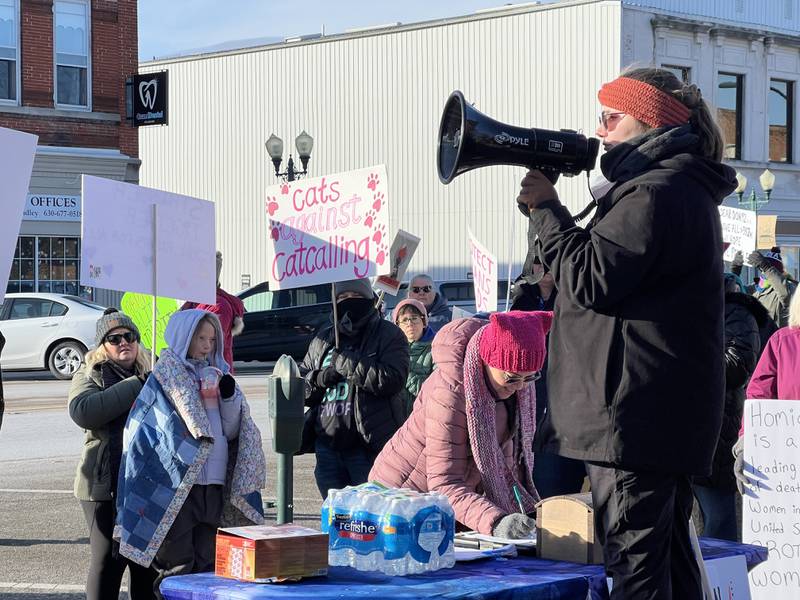 Safe Passage prevention and communications manager, Beth Ganion (right), leads the crowd in chants such as "Hey, hey, ho, ho, violence against women has got to go." Ganion was the lead organizer of the nearly two-hour women's march on Saturday, Jan. 18, 2025, held outside the DeKalb County Courthouse in downtown Sycamore.