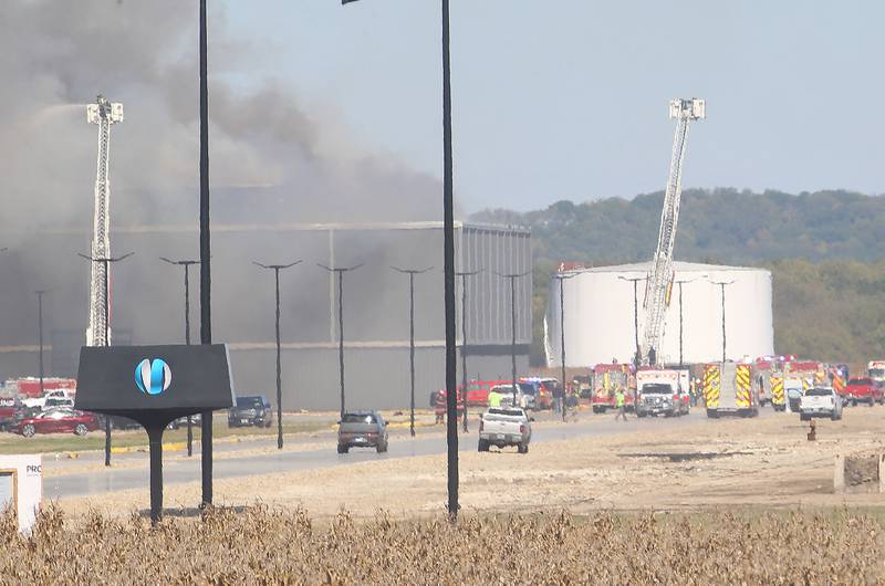 Smoke billows from Marquis Energy as firefighters work to control a structure fire on Wednesday, Oct. 8, 2025 in Hennepin. The fire was upgraded to a 5th alarm dispatching the (MABAS) Mutual Aid Box Alarm System. The fire broke out around 11a.m.