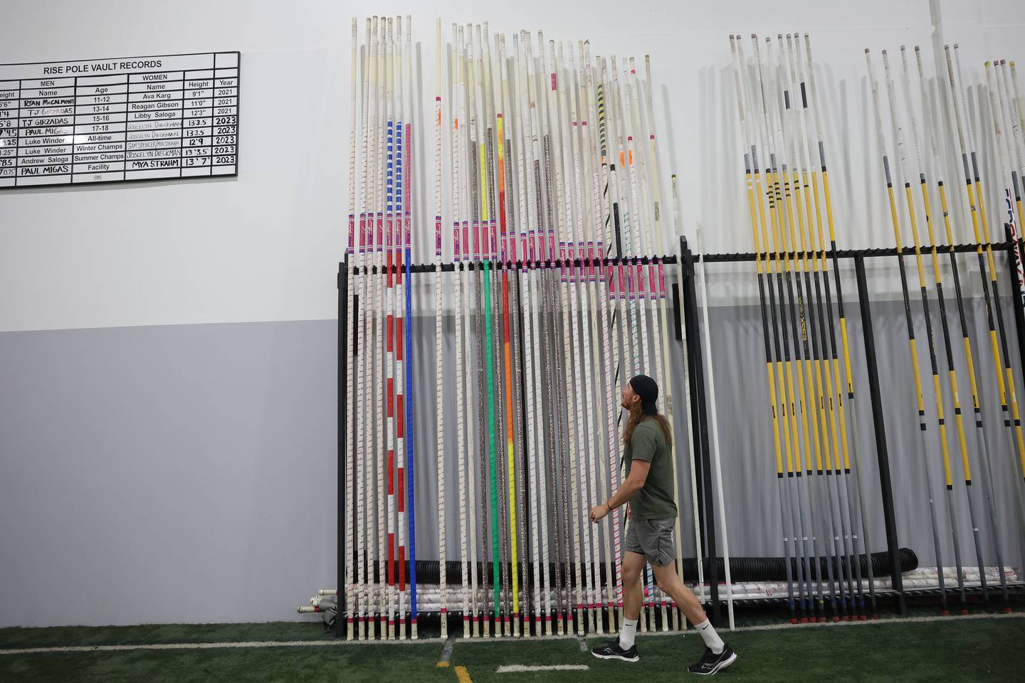 Luke Winder stands by his set of poles at the Rise Pole Vault training facility on Wednesday, May 29, 2024 in Joliet. Luke will be competing in the U.S Olympic trials in June, where the top three pole vaulter with my the Olympic team.