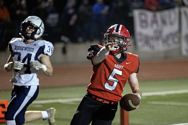 Amboy’s Landon Whelchel point to the fans after scoring against Ridgewood during the I8FA championship Friday, Nov.17, 2023 at Monmouth College