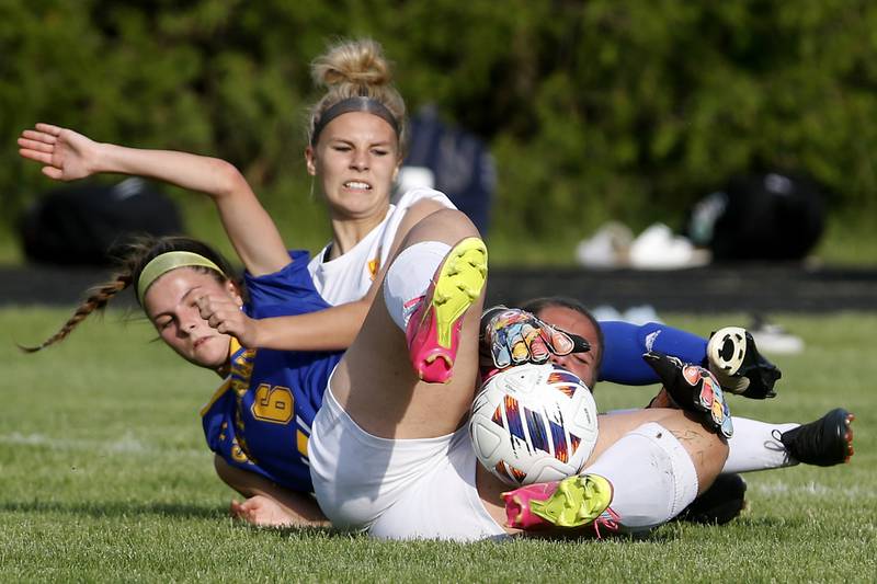 Richmond-Burton's Taylor Labay tries to regain control after taking it away from Johnsburg's Elizabeth Smith as Richmond-Burton's Blake Frericks provides defense during the IHSA Class 1A Marian Central Sectional Championship match on Tuesday, May 21, 2024, at Marian Central High School.