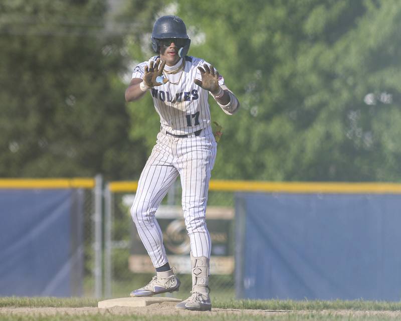 Oswego East's Jacsen Tucker (17) calls a timeout after hitting a double during baseball game between Oswego East at Oswego. Monday, May 19, 2025 in Oswego.