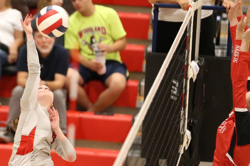 Woodland's Sadie Darm spikes the ball over Earlville on Wednesday, Sept. 25, 2024 at Woodland High School.