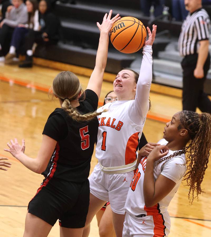 DeKalb's Ella Russell tries to shoot over Rockford East's Aubrey Phillip during their game Wednesday, Jan. 22, 2025, at DeKalb High School.