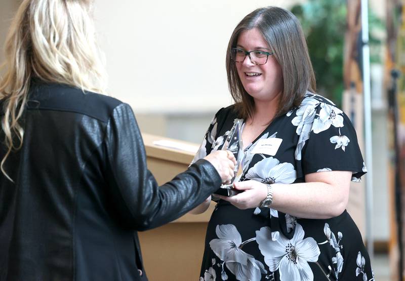 Kari Maratos, co-owner of the Sycamore State Theater, accepts the Sycamore Chamber of Commerce Community Diamond Award on behalf of the theater during the 106th Annual Chamber Meeting Thursday, March 2, 2023, in Memorial Hall at St. Mary's Catholic Church in Sycamore.