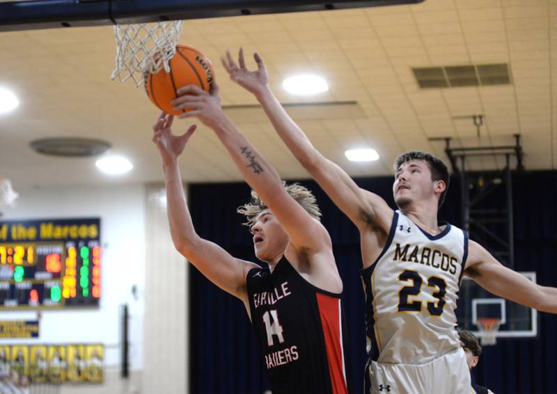 Polo's Noah Dewey (23) reaches for a rebound against Earlville's Adam Waite (14) on Monday, Feb. 10, 2025 at Polo High School.