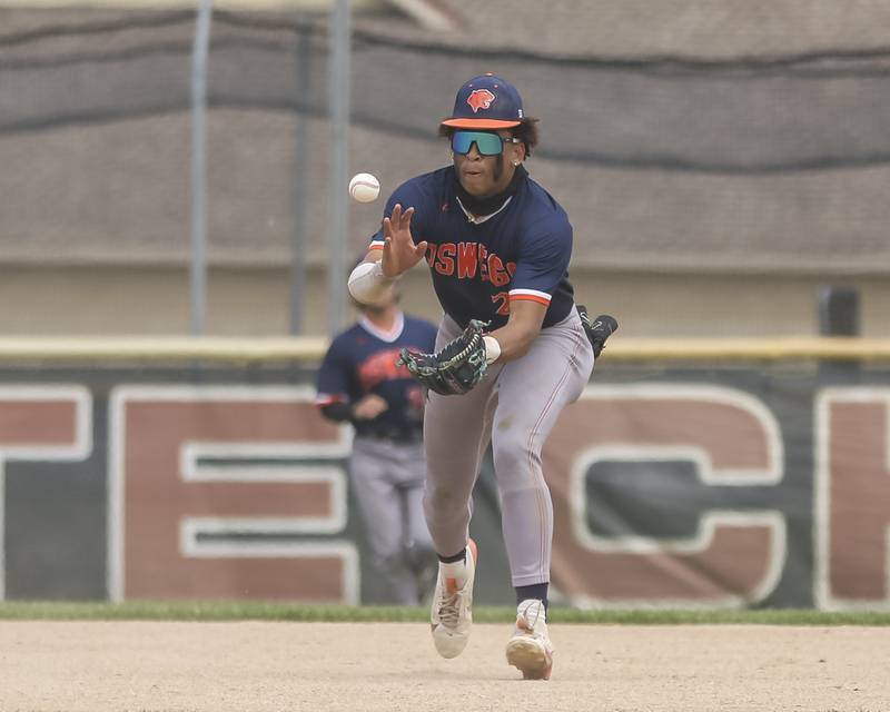 Oswego's Kam Jenkins (25) fields a ball off of a bad hop that eluded Conor Tully (23) during Class 4A Plainfield North Regional final baseball game between Oswego at Plainfield North. Saturday, May 31, 2025 in Plainfield.