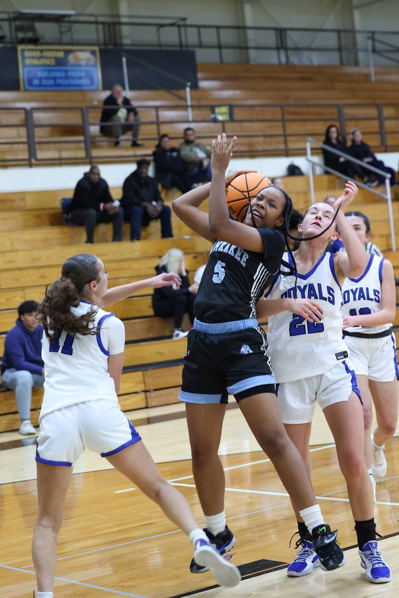 Kankakee's LaMaryah Smith draws a foul from Rosary players during the Kays' 75-28 victory over Rosary at the Reed-Custer Classic on Monday, Nov. 17, 2025.