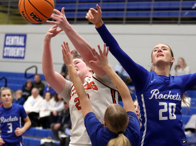 Burlington Central’s Ainsley Wilson, right, and Crystal Lake Central’s Leah Spychala reach for a rebound in IHSA Class 3A Regional Title Game girls basketball action on Thursday, Feb. 20, 2025, at  Central High School in Burlington.