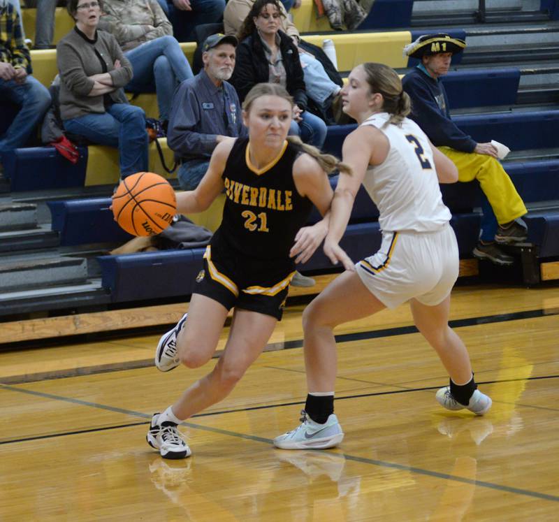 Riverdale's Cayleigh Hungate drives past Polo's Laynie Mandrell on Saturday, Jan. 18, 2025 at Polo High School.