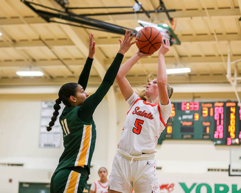St Charles East's Brooklyn Schilb (5) puts up a shot during their York Thanksgiving Tournament game between St Charles East at Waubonsie Valley on Monday, Nov 18, 2024  in Elmurst.