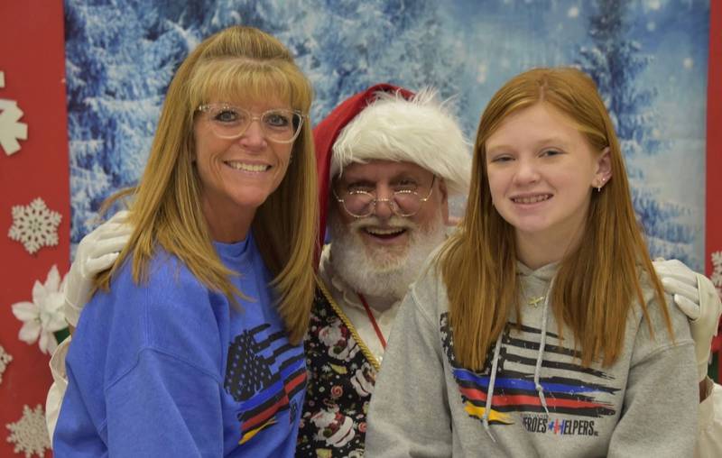Wendy Briley and her granddaughter, Avery, during last year's An Evening with Santa event. Briley's family gets involved and helps with the events, as well.