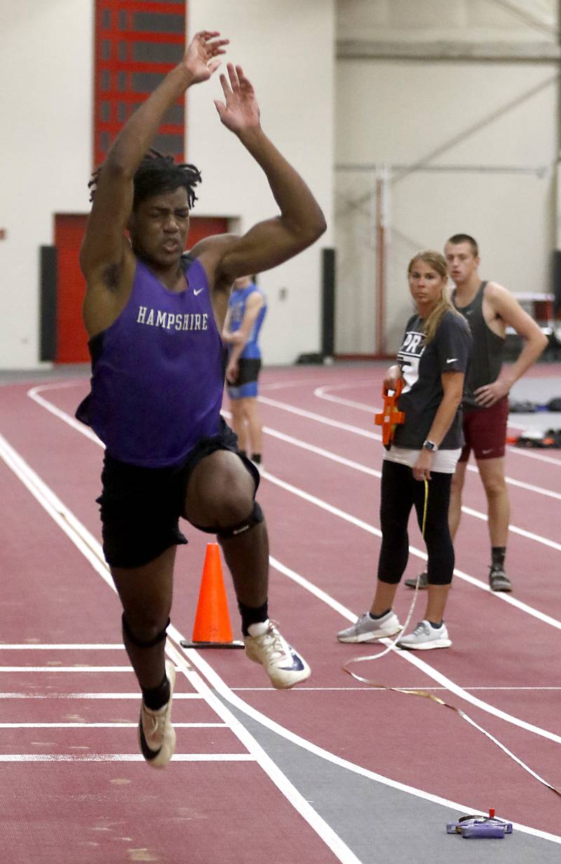 Hampshire’s Vince Scott triple jumps Friday, May 12, 2023, during the Fox Valley Conference Boys Track and Field Meet at Huntley High School.