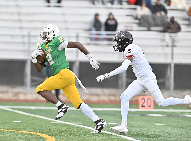 Providence Catholic's Xavier Coleman (2) out runs Springfield's Davonte Brown (5) for a touch down during the class 5A first round playoff game on Saturday, NOV. 01, 2025, at New Lenox.